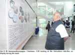 Shri K. M. Hanumantharayappa, Chairman, CSB looking at the Sericulture info-flex on display during the meet